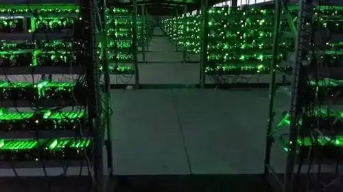 Large scale Bitcoin mining farm in China glowing with rows of mining rigs