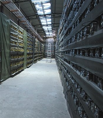 Large mining farm with rows of mining rigs under cooling systems