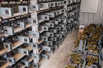 A large-scale mining farm with rows of mining rigs, showcasing the scale of modern mining operations.