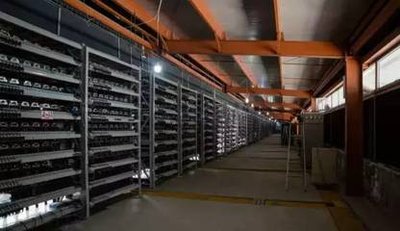 A mining farm displaying multiple ASIC rigs for cryptocurrency mining